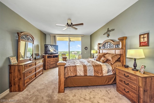 carpeted bedroom with ceiling fan and access to outside