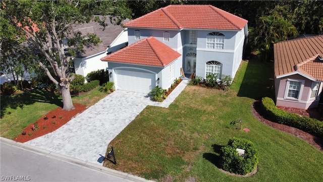 view of front facade with a garage and a front yard