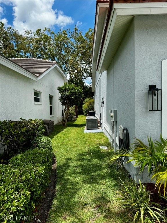 view of yard with central AC unit