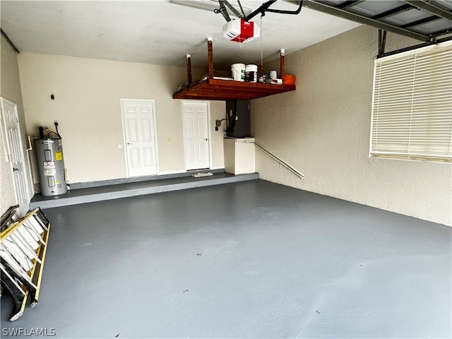 garage featuring a garage door opener and water heater