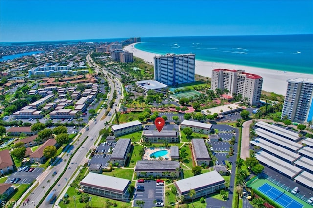 bird's eye view with a beach view and a water view