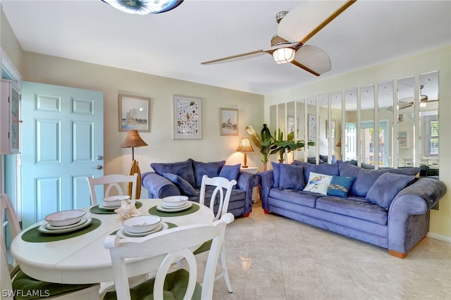 tiled living room featuring ceiling fan