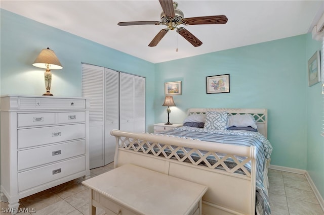 tiled bedroom with a closet and ceiling fan