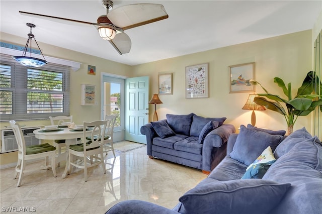 living room with ceiling fan and light tile flooring