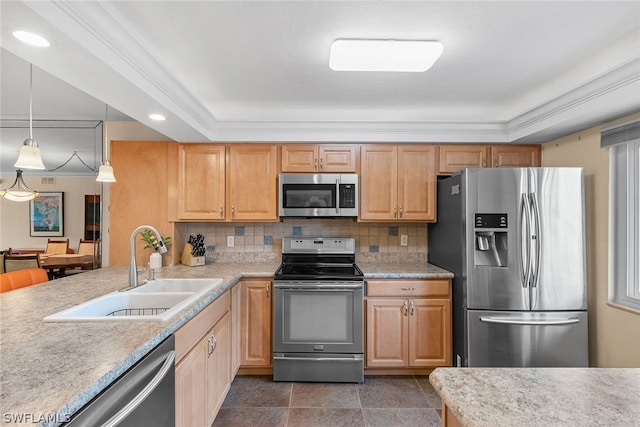 kitchen featuring appliances with stainless steel finishes, sink, backsplash, a raised ceiling, and pendant lighting