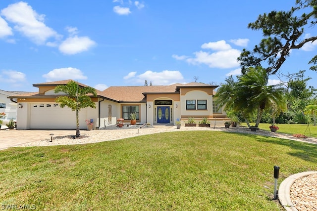 view of front of property with a garage and a front yard