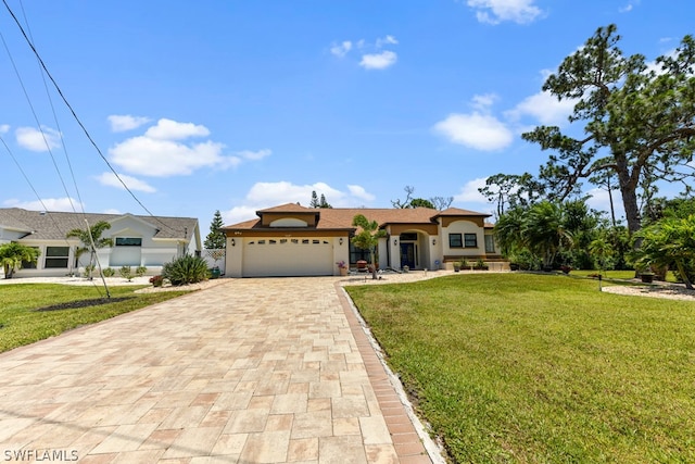 view of front facade featuring a garage and a front lawn