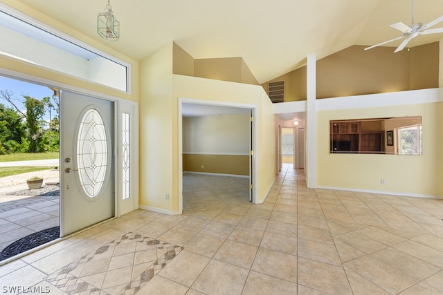 foyer entrance featuring high vaulted ceiling, ceiling fan, and light tile flooring