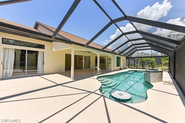 view of pool with a patio area, ceiling fan, and a lanai