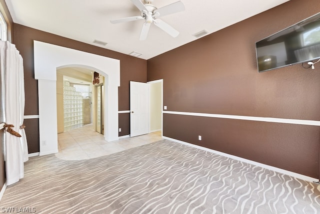 empty room with light carpet and ceiling fan