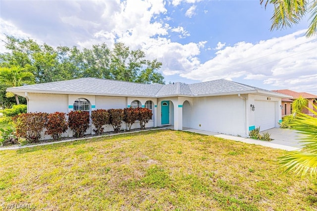 ranch-style home with a garage and a front yard