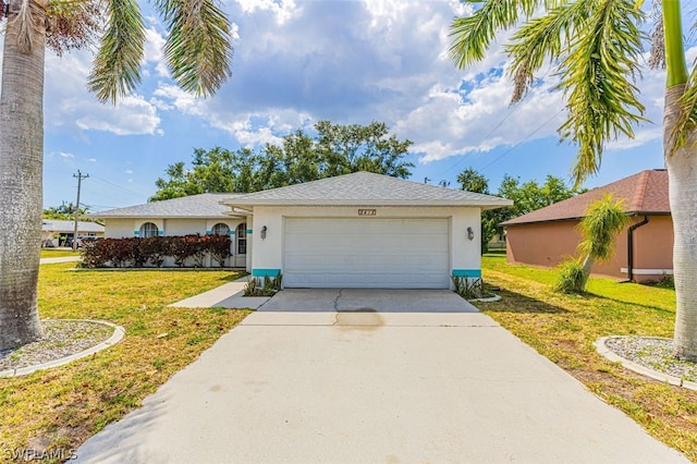 ranch-style home with a garage and a front lawn