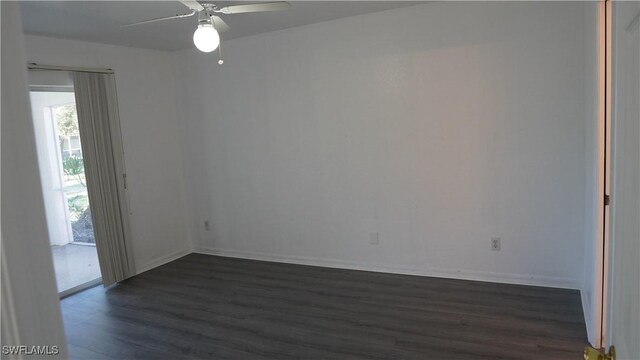 unfurnished room featuring dark hardwood / wood-style floors and ceiling fan