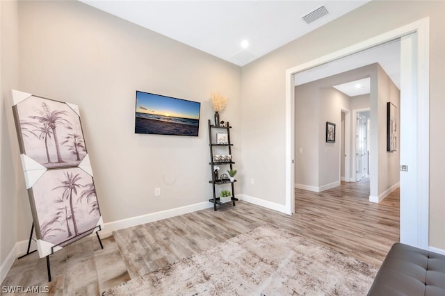 unfurnished room with light wood-type flooring