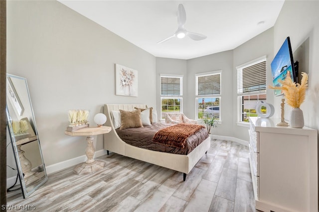 bedroom featuring ceiling fan and light wood-type flooring