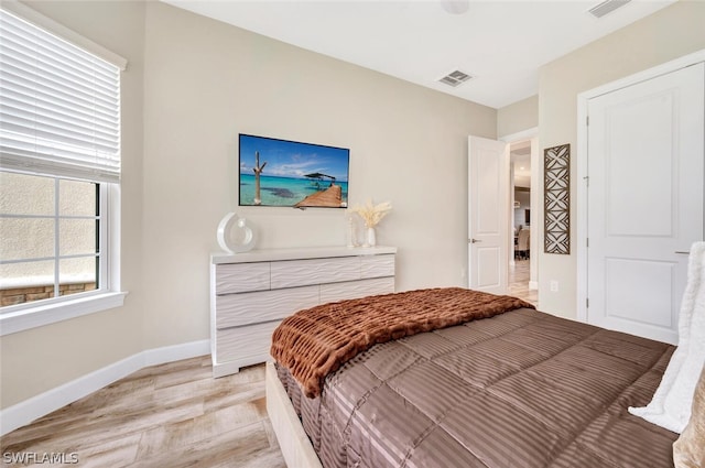 bedroom featuring light hardwood / wood-style floors