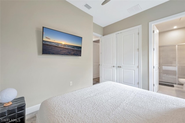 bedroom with a closet, ceiling fan, hardwood / wood-style floors, and ensuite bathroom