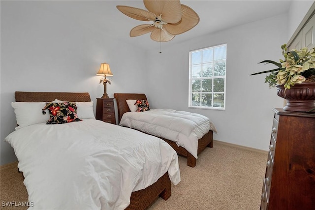 bedroom featuring ceiling fan and light colored carpet