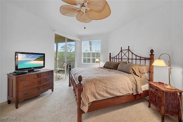 carpeted bedroom featuring access to exterior and ceiling fan