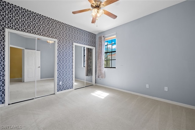 unfurnished bedroom featuring carpet and ceiling fan