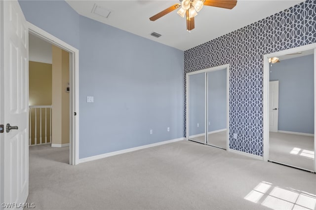 empty room with carpet and ceiling fan