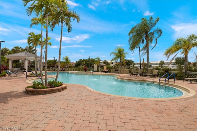 view of swimming pool featuring a patio area