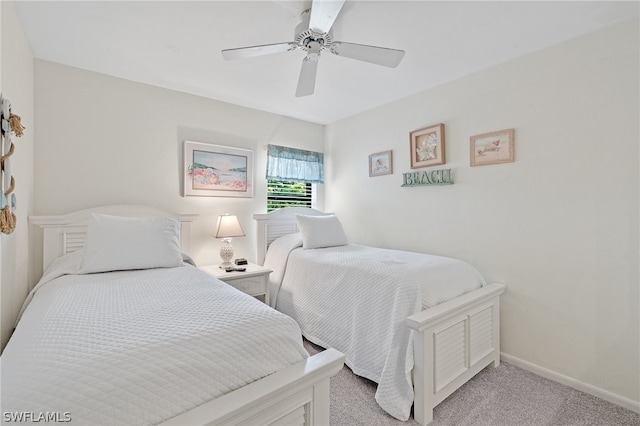 bedroom with light carpet and ceiling fan