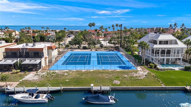 exterior space featuring a water view and a yard