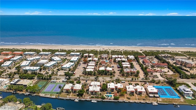 birds eye view of property with a view of the beach and a water view