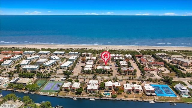 drone / aerial view featuring a view of the beach and a water view