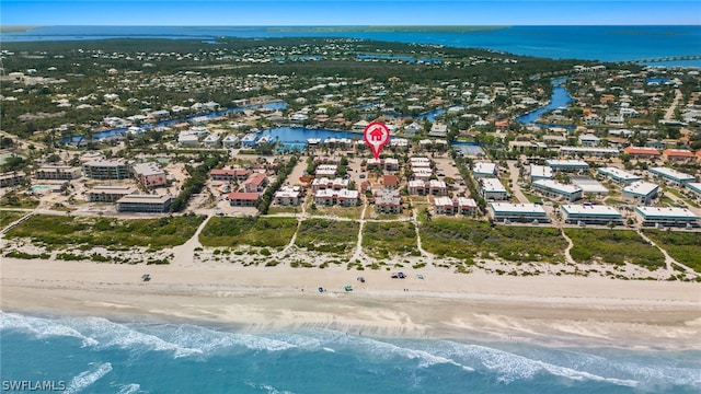 bird's eye view featuring a beach view and a water view