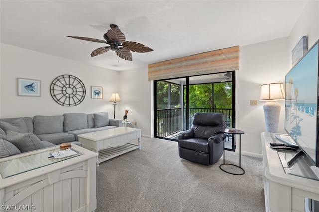 living room with carpet flooring and ceiling fan