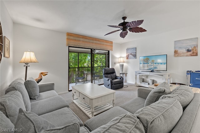 carpeted living room featuring ceiling fan