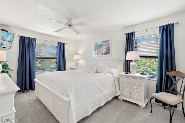 bedroom with light carpet and ceiling fan