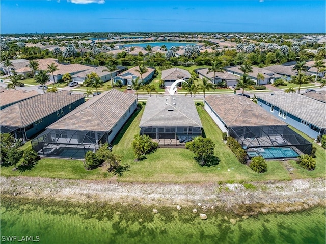 birds eye view of property with a residential view