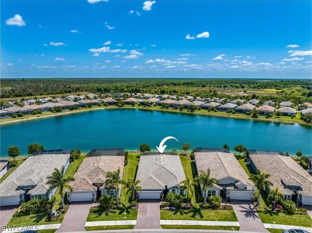 birds eye view of property featuring a residential view and a water view