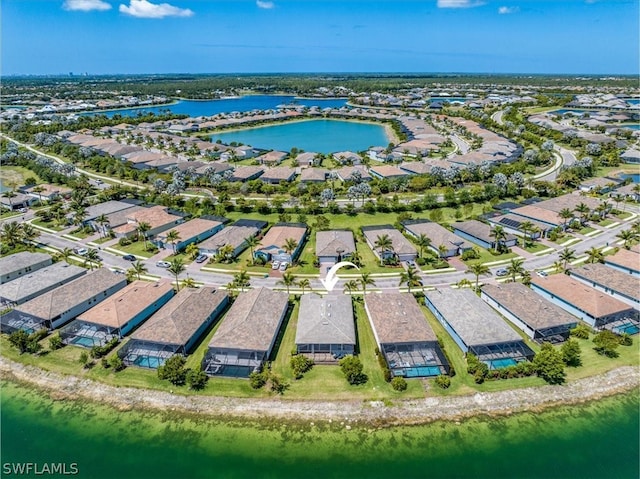 bird's eye view with a water view and a residential view