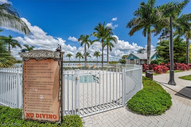 view of gate with a community pool