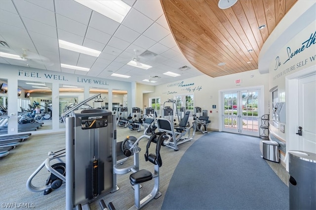 workout area with carpet, ceiling fan, and french doors