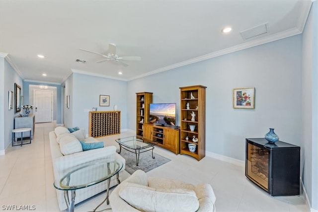 living room featuring ornamental molding, light tile patterned floors, and ceiling fan