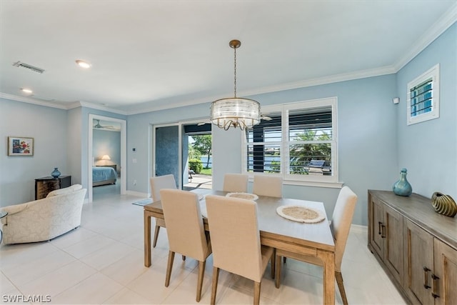 dining space featuring visible vents, a healthy amount of sunlight, and crown molding