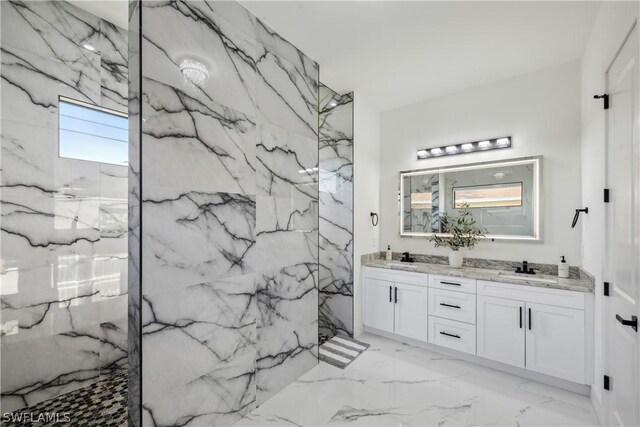 bathroom featuring a shower and vanity