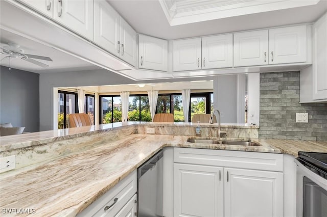 kitchen featuring white cabinets, light stone countertops, dishwasher, and sink