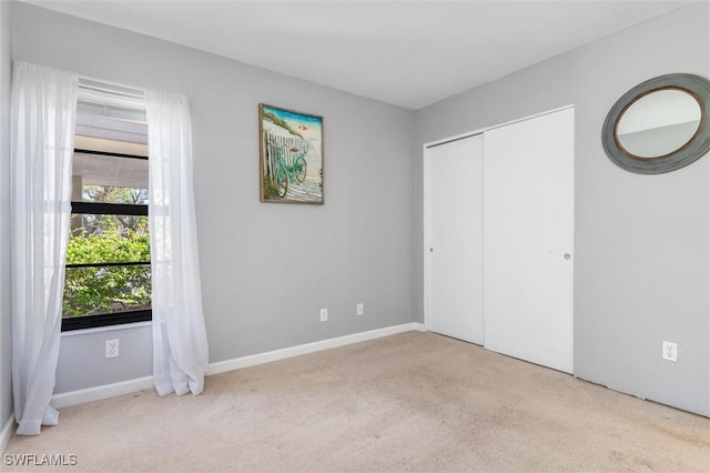 unfurnished bedroom with light carpet