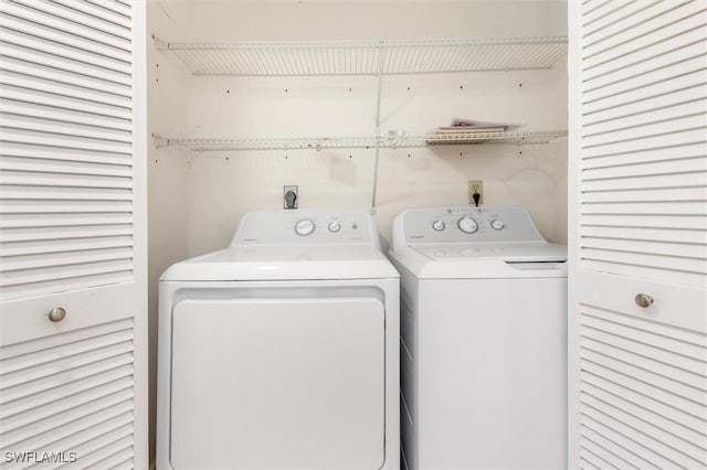 washroom with washer and dryer