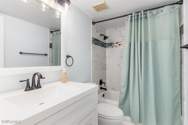 full bathroom featuring shower / bath combination with curtain, vanity, and toilet