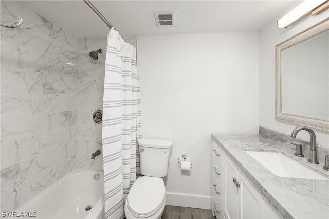 full bathroom with vanity, shower / bath combination with curtain, and toilet