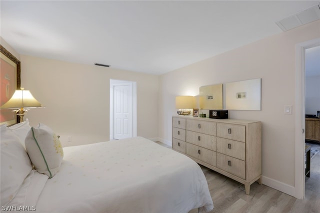 bedroom featuring light hardwood / wood-style flooring