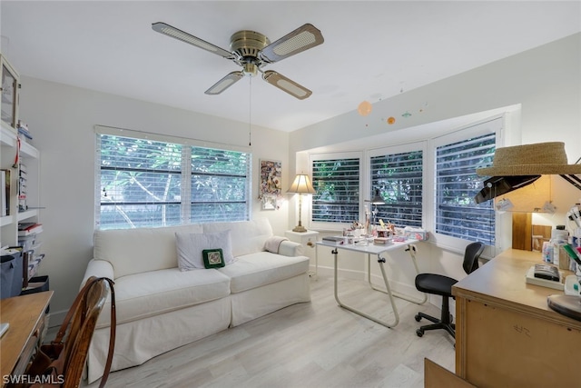 interior space with ceiling fan and light hardwood / wood-style floors