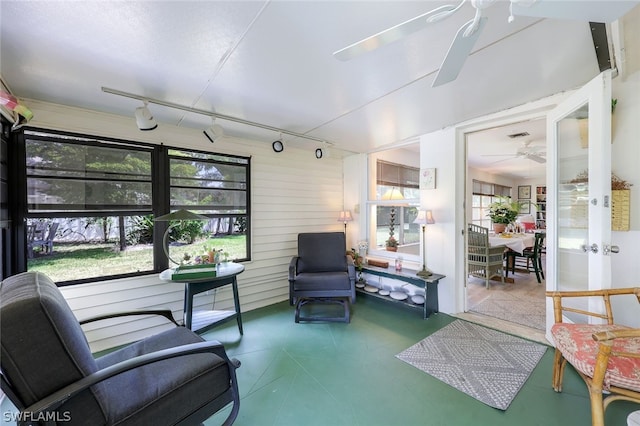 interior space with french doors, ceiling fan, and track lighting